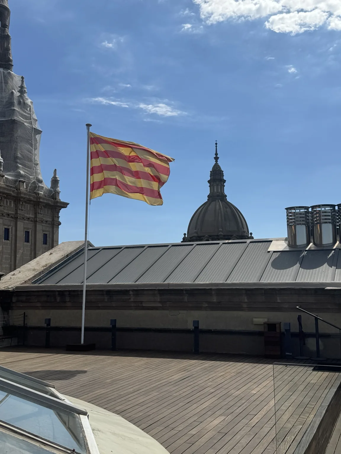 The Catalan flag flying over the city.